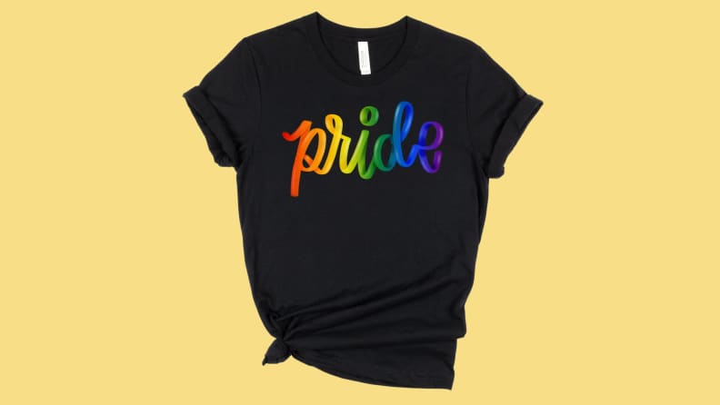 A black WildflowerandPenny brand T-shirt from Etsy on a yellow background.