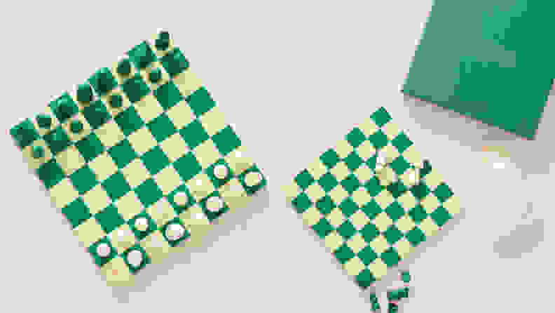 A green and cream chess set.