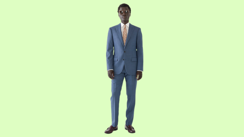 A model wearing a blue suit.