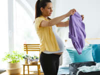Pregnant woman packing hospital bag