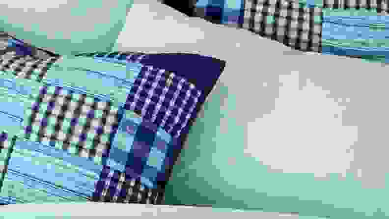 land's end flannel sheets on a bed with a navy patchwork quilt