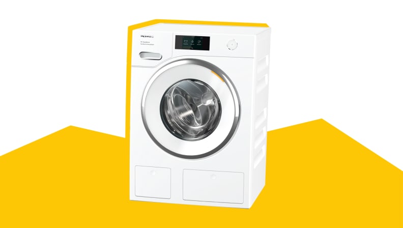 A Miele compact washer on a yellow and white background