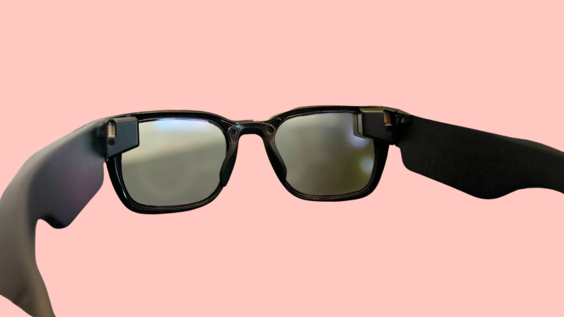 A pair of XanderGlasses on a pink background.