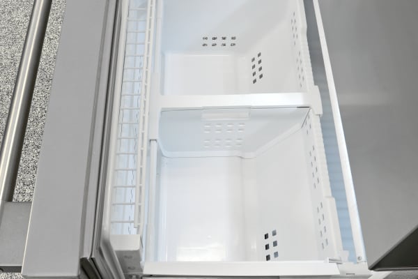 The divider found in the bottom section of the Frigidaire Professional FPBC2277RF's freezer is adjustable. Also, notice the small shelf just inside the door.