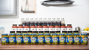 Four rows of jars in the Reviewed test lab kitchen: Vlasic Kosher Dill Speaers, 365 Marinara sauce, lemonade, and more.