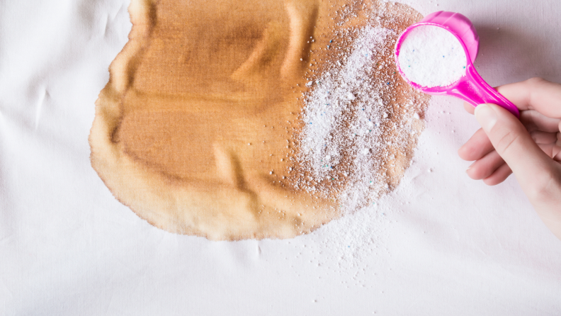 To a tough stain on cotton, add on a sprinkle of powdered, color-safe bleach alternative and work this powerful paste into the stain with a brush.