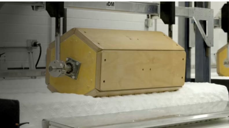 a roller presses on the Cocoon by Sealy