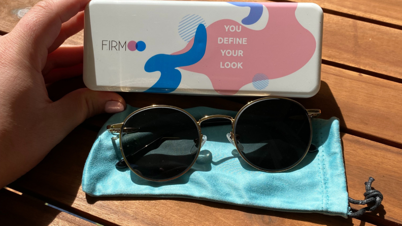 Firmoo sunglasses on a blue cloth