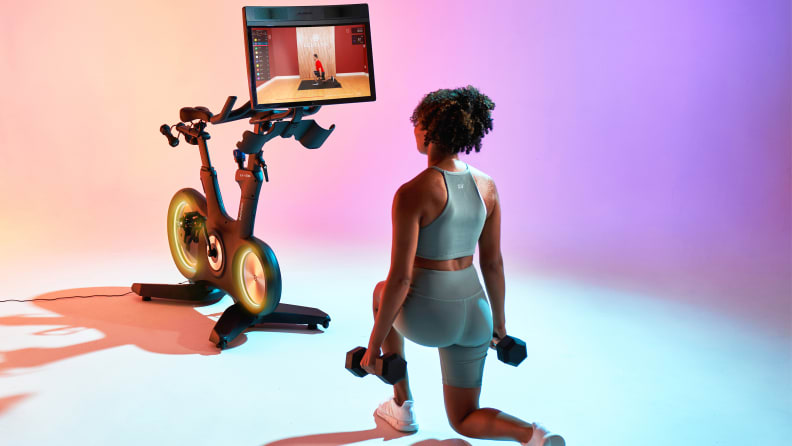 A woman exercising with the Echelon Fitness EX-8S