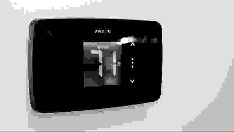 The Sensi Lite thermostat appears on a gray wall.