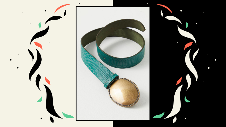 An embossed leather belt with a brass oval belt buckle.