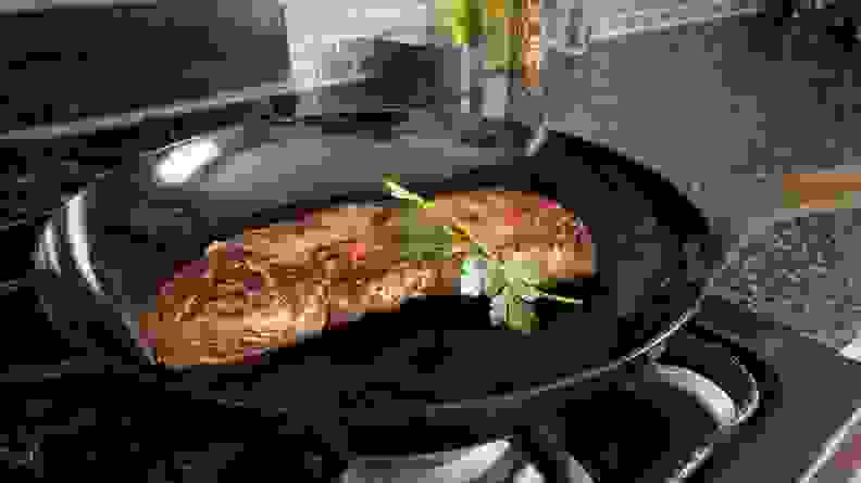 A steak searing in Mauviel carbon steel skillet.