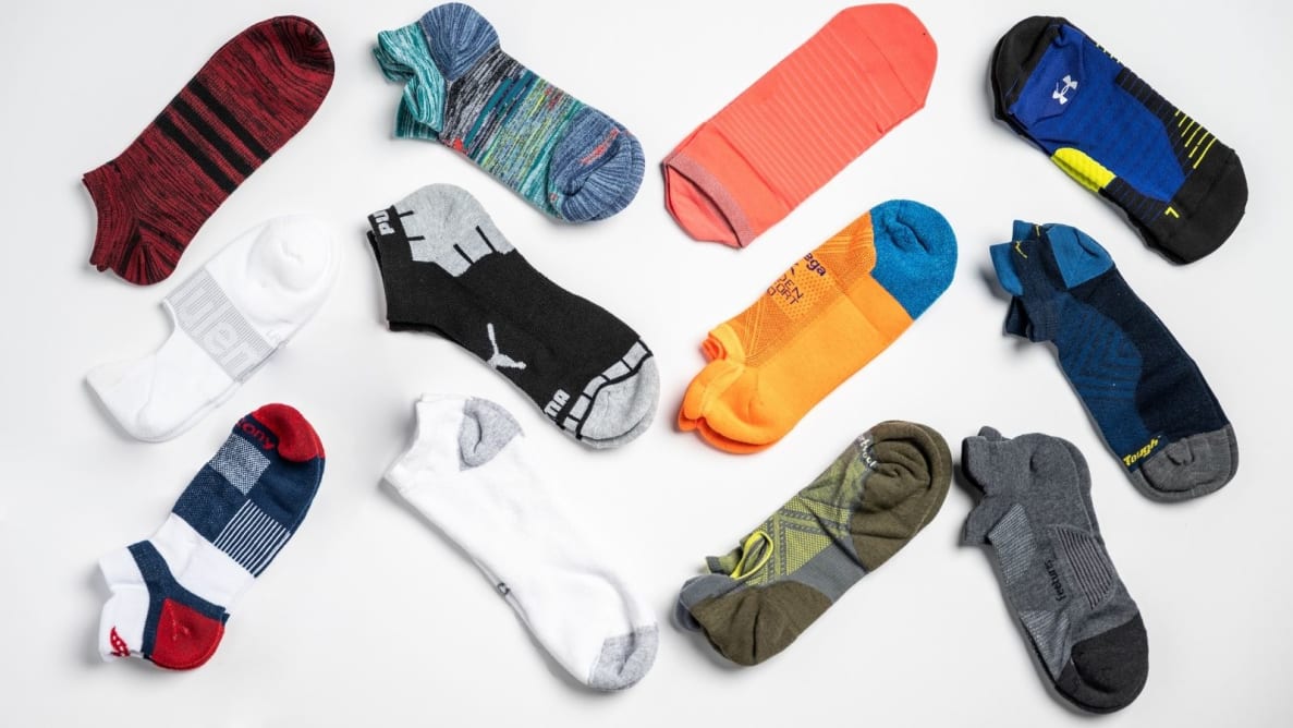 An array of unisex running socks from brands like Nike, Puma, and Saucony.