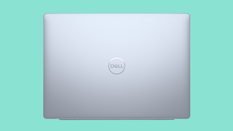 The Dell Inspiron Plus 14 closed on a green background.