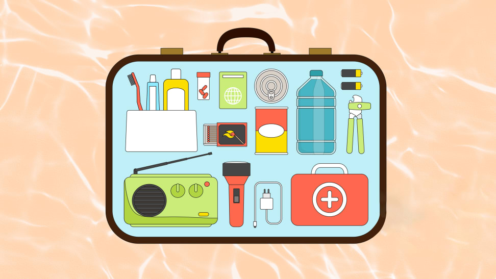 Suitcase filled with emergency essentials like water, medicine, a flashlight