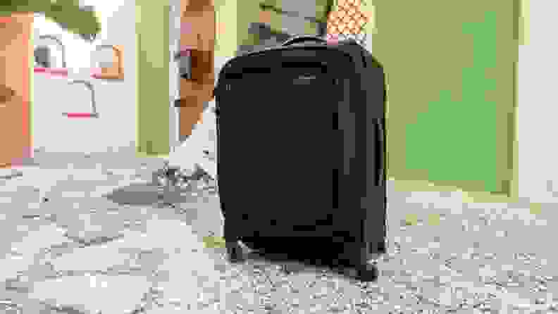Samsonite luggage standing on a floor