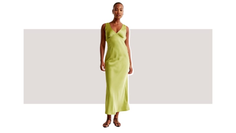 A model wearing a green satin dress.
