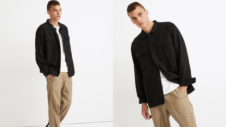 Man wearing khaki pants and oversized black military jacket from Madewell.