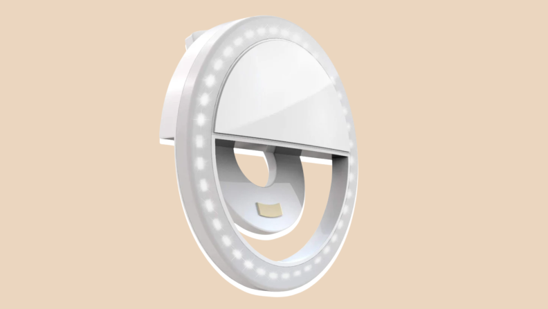 A Selfie Light Ring on a vanilla-colored background.