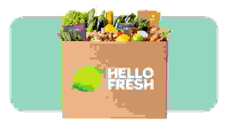 A box with the Hello Fresh logo and fresh food.