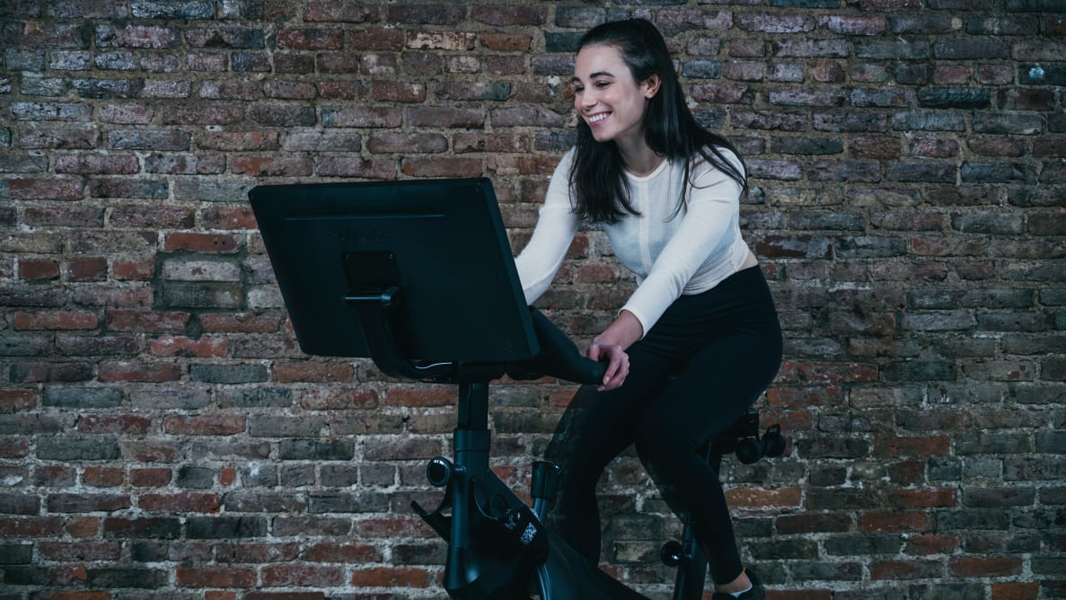 A Reviewed editor tests out an exercise bike in our Cambridge offices.