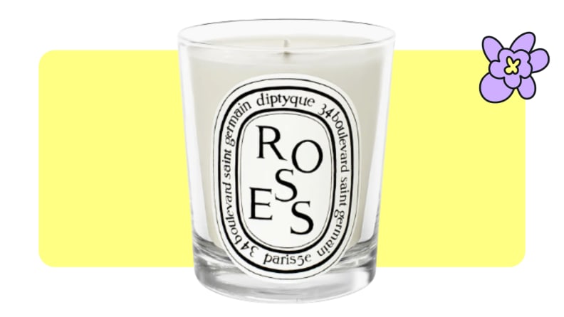 A full Diptyque rose-scented candle with a black and white label on front.