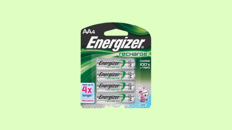Package of AAA batteries against green background