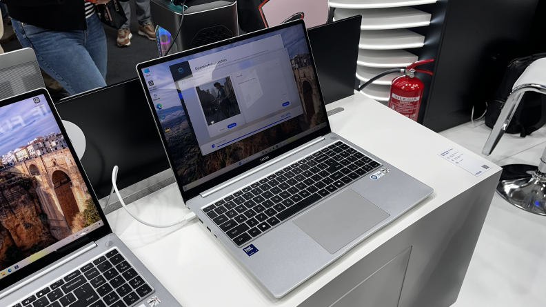 The Tecno MegaBook T16 Pro displayed open on a white stand.
