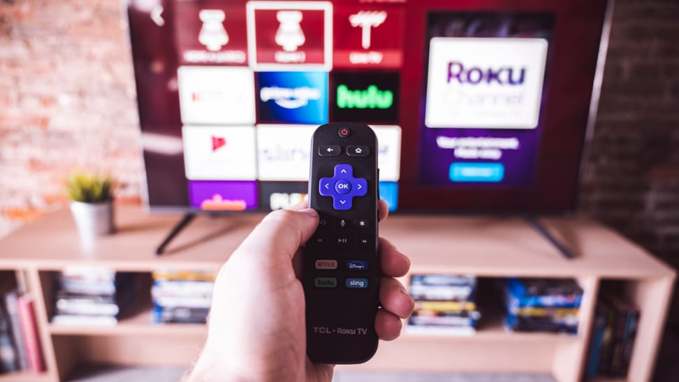 The 65-inch TCL 6-Series with the Roku remote control in the foreground