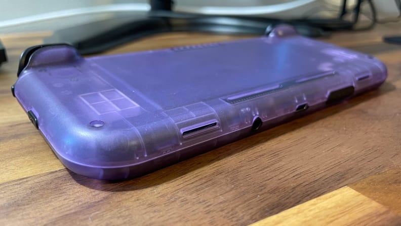 Looking at the back of a clear purple gaming handheld with shoulder triggers