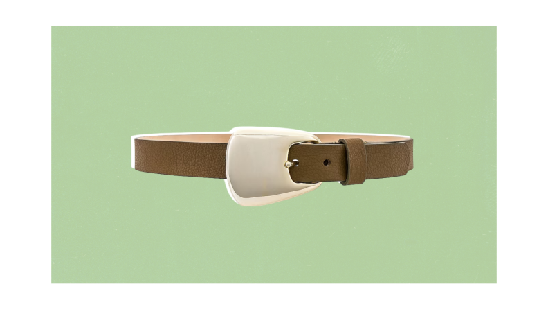A wide, olive green belt with a large, oversized silver belt buckle.