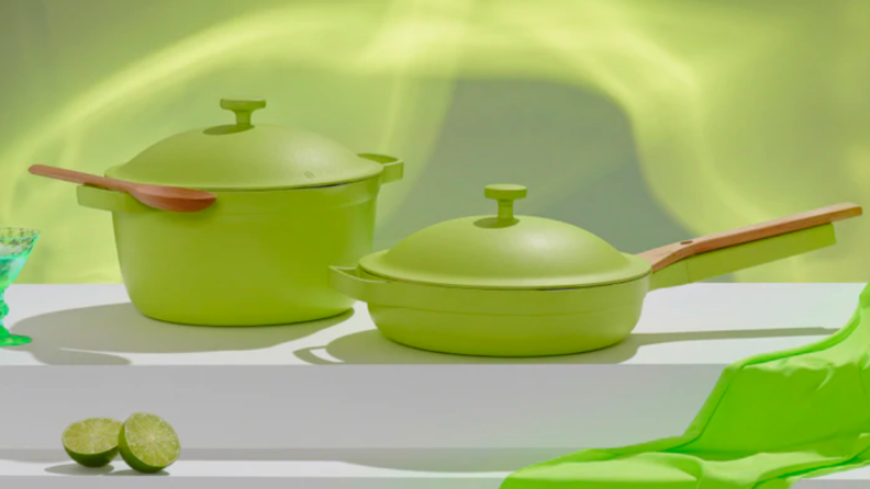 A pair of lime green pots and pans.