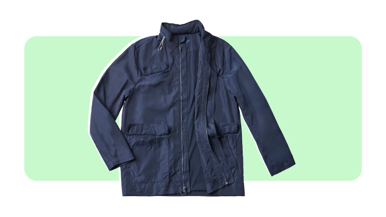 A Magnaready jacket in the color navy on a green and white background.