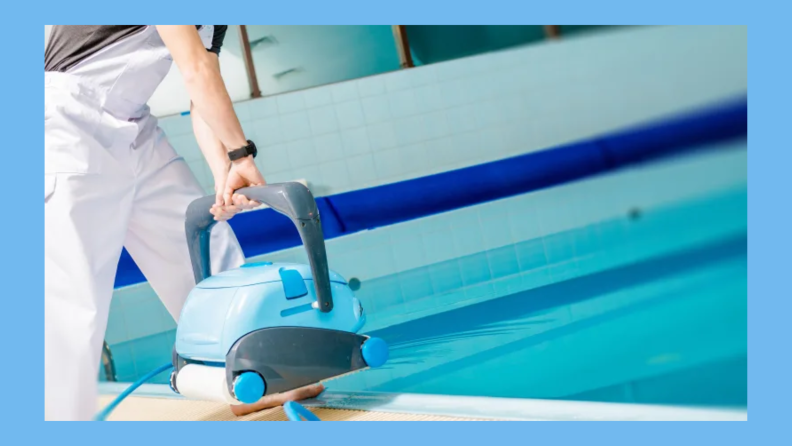 Someone preparing to use a robot vacuum for the bottom of a pool.