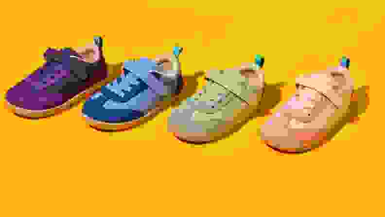 Yellow background with all 4 colors of retro suede sneaker (purple, blue, green pink)