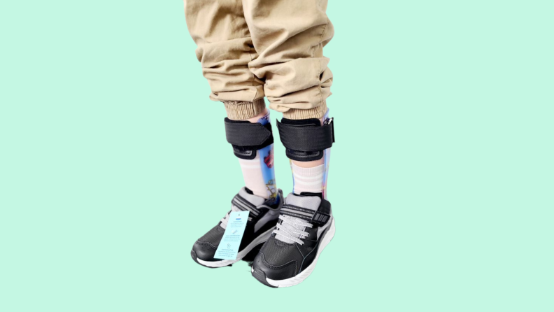 A kid with leg braces on wearing the Stride Rite kids shoes.
