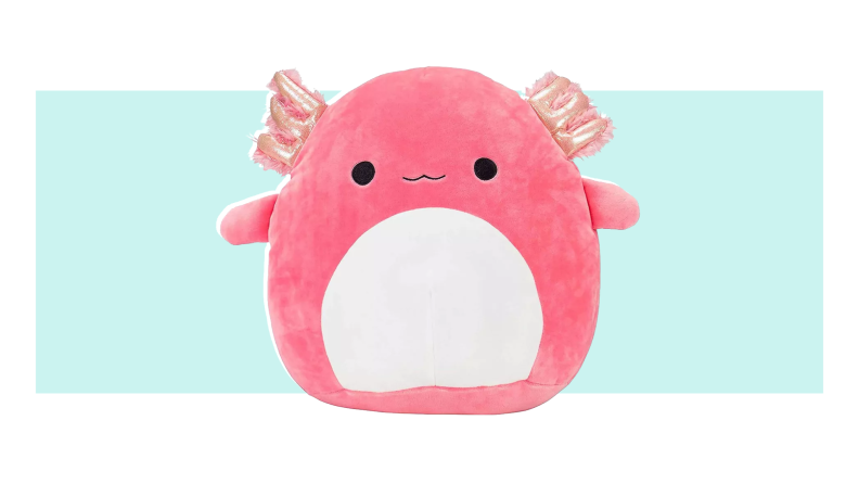 A pink Archie the Axolotl Squishmallow with a white belly.