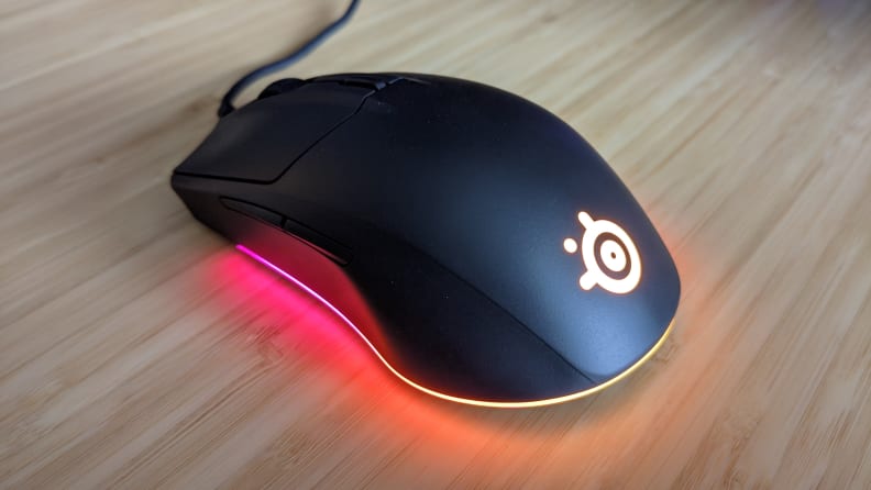A computer mouse with glowing lights coming from the bottom