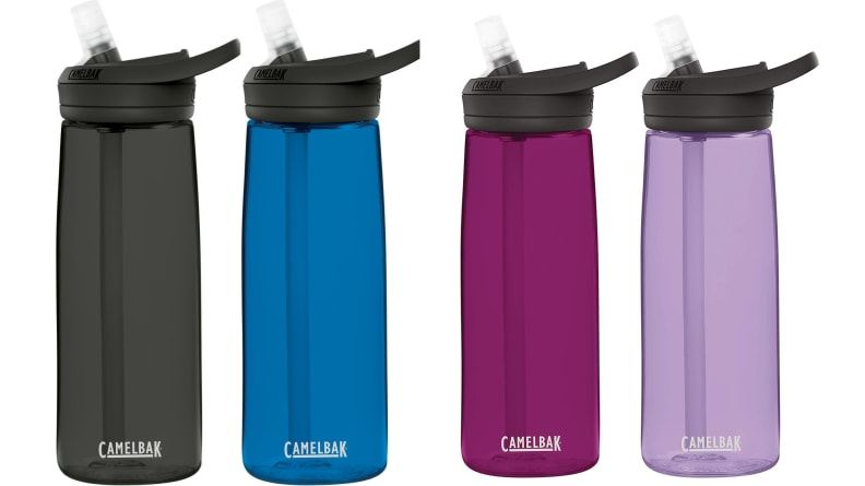 Four water bottles of different colors on a white background