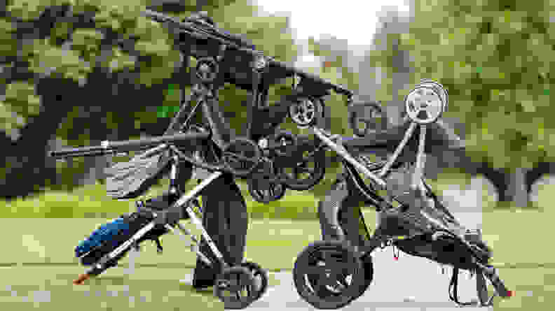 A pile of baby strollers