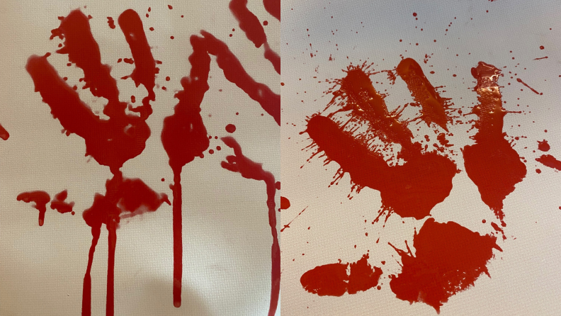 Faux bloody handprints on bath mat.