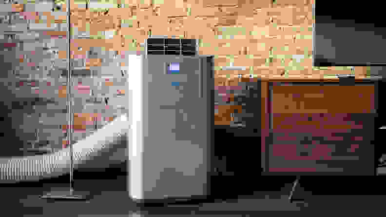 A Whynter portable air conditioner, properly installed and venting offscreen.
