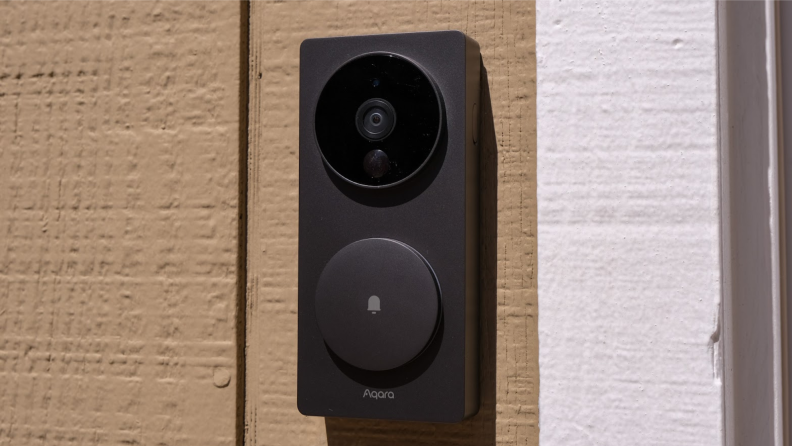The Aqara Video Doorbell on the side of a home