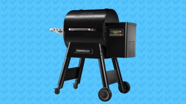 Traeger Ironwood 650 pellet grill on blue background