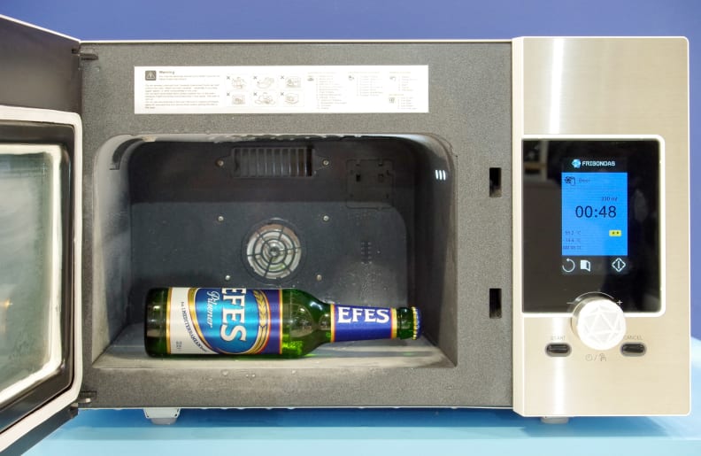 Frigondas Microwave Freezer with a cold beer inside