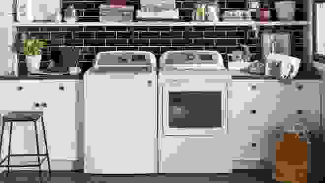 White washing machine and dryer set in a chic laundry room