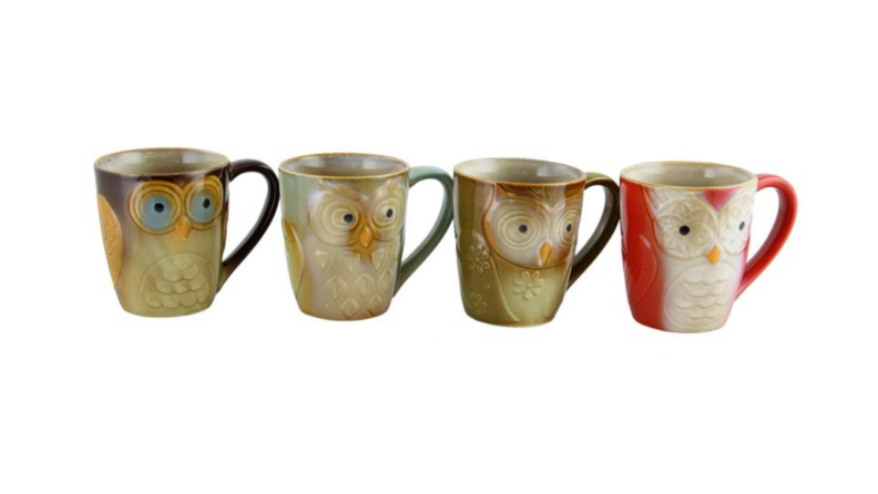 An image of four owl mugs lined up next to each other.