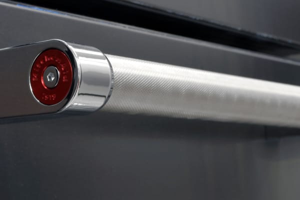 At each handle end on the KitchenAid KRMF706EBS, you'll find an attractive red emblem featuring the KitchenAid logo.