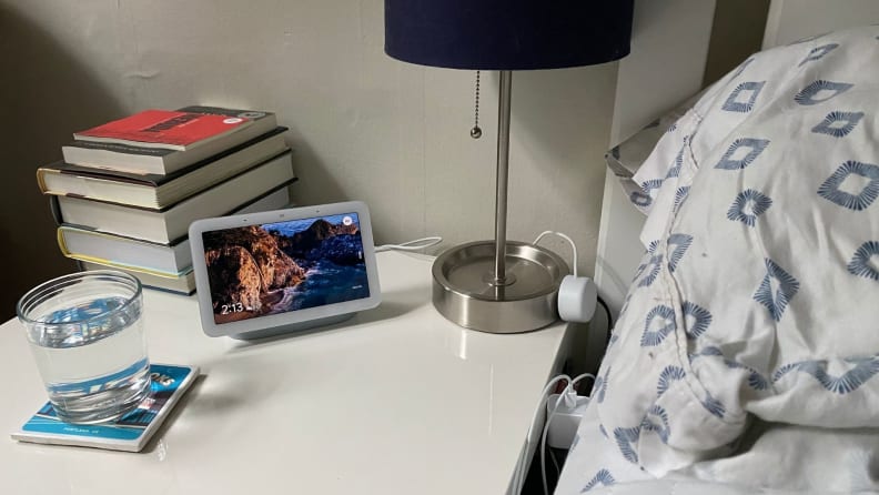 the nest hub on a bedside table