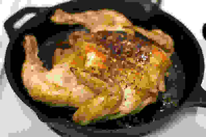 cast iron skillet with chicken